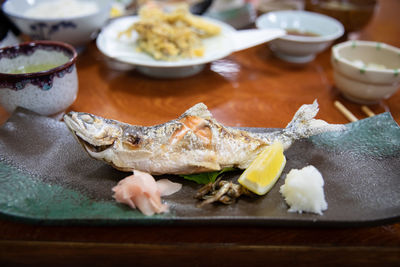 Close-up of fish in plate on table