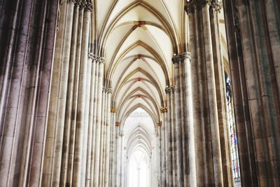 Low angle view of cross in building