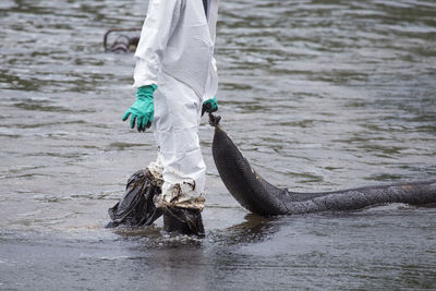 Full length of man in river