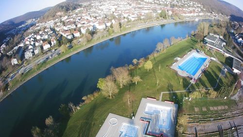 High angle view of buildings and trees in city