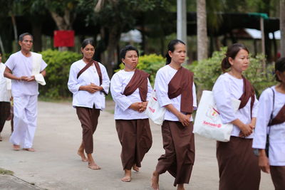 Group of people walking outdoors