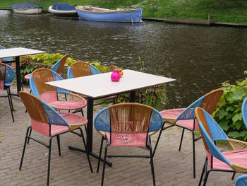 High angle view of chairs and tables in lake
