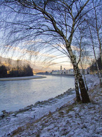 Scenic view of river against sky during winter