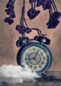 Close-up of clock on table