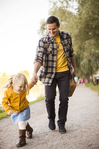 Father walking with girl