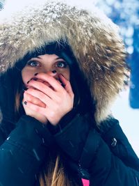 Portrait of young woman in snow