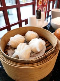 Close-up of dim sum in bowl on table