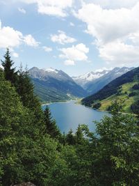 Scenic view of lake and mountains against sky