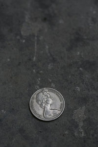 High angle view of coins on floor