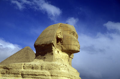 Low angle view of statue against sky