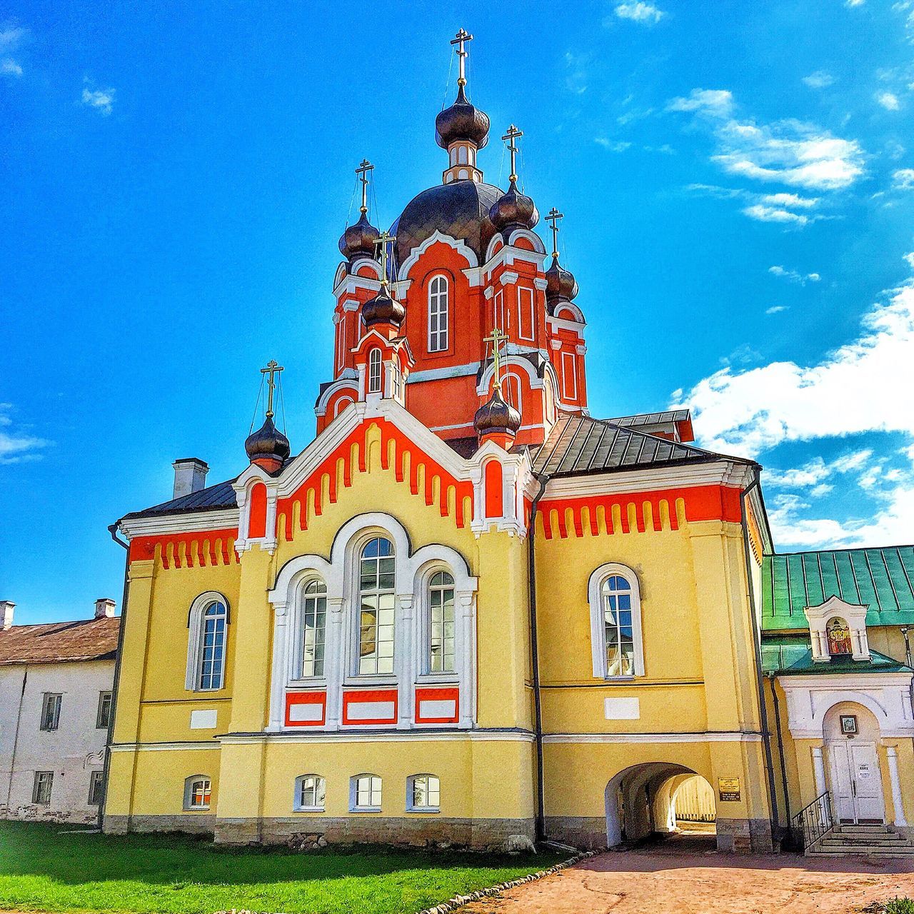 building exterior, place of worship, religion, architecture, church, built structure, spirituality, sky, cathedral, low angle view, cross, facade, blue, dome, outdoors, day, sunlight, cloud