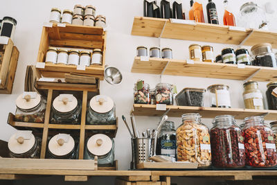 Mason jars arranged on racks in zero waste store