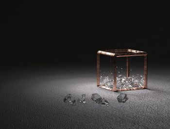 High angle view of glass container on table against black background