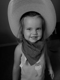 Portrait of young woman wearing hat