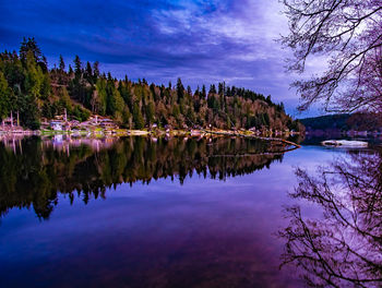 Scenic view of lake against sky at dusk