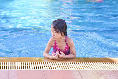 High angle view of woman swimming in pool
