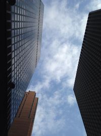 Low angle view of building against cloudy sky