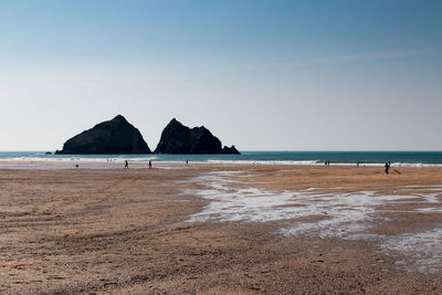 Scenic view of beach against clear sky