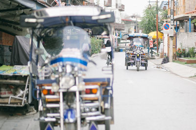 Vehicles on road along buildings