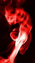 Close-up of red object over black background