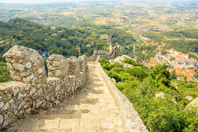 High angle view of steps on mountain during sunny day