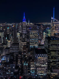 Illuminated buildings in city at night