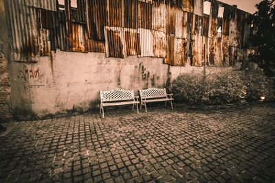 View of empty alley amidst buildings in city