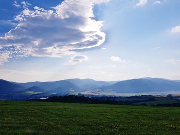 Scenic view of field against sky