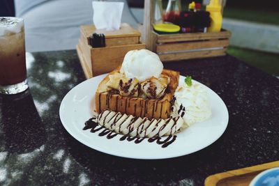 Close-up of cake served on table