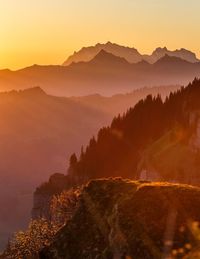 Scenic view of mountains against sky during sunset