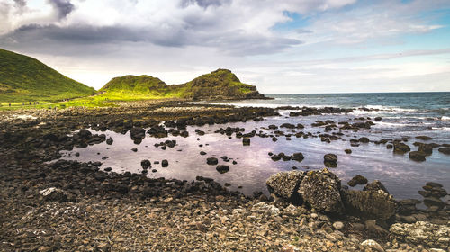 Rocks on shore against sky