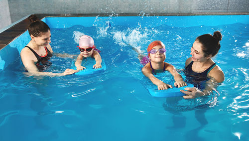 High angle view of boy swimming in pool