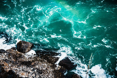 High angle view of rocks in sea