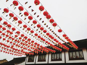 Low angle view of lanterns hanging on roof