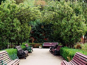 Empty bench on footpath