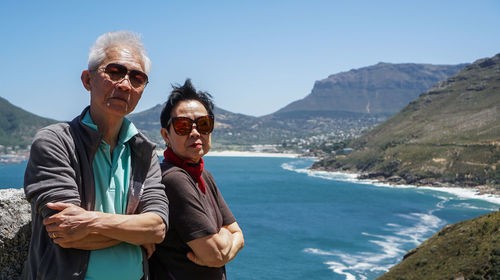 Asian senior couple anniversary trip to africa beautiful landscape and wild nature holiday 