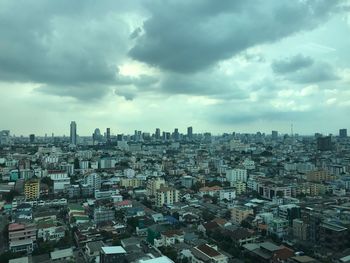 High angle view of buildings in city against sky