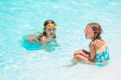 Woman swimming in pool