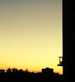 Built structure against clear sky at sunset