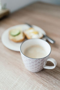 Close-up of coffee cup on table