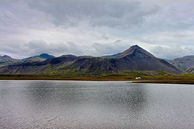 Scenic view of mountains against cloudy sky