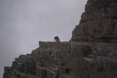 Low angle view of castle against cloudy sky