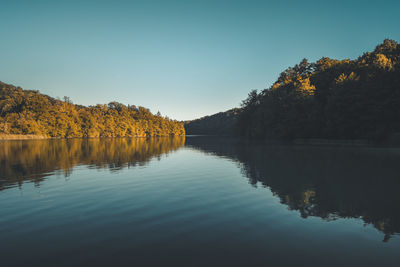 Scenic view of lake against sky during autumn