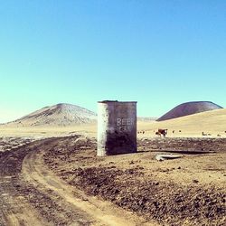 View of landscape against clear blue sky