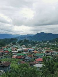 Scenic view of residential district against sky