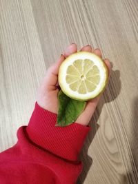 High angle view of woman holding fruit