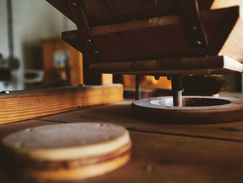 Close-up of machine part on table
