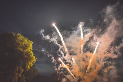 Low angle view of illuminated sky at night