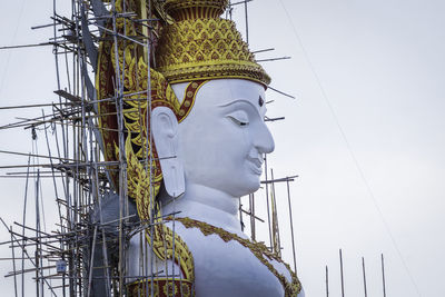 Low angle view of statue against sky