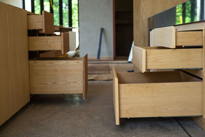 Opening wooden shelves under installation inside the house under construction